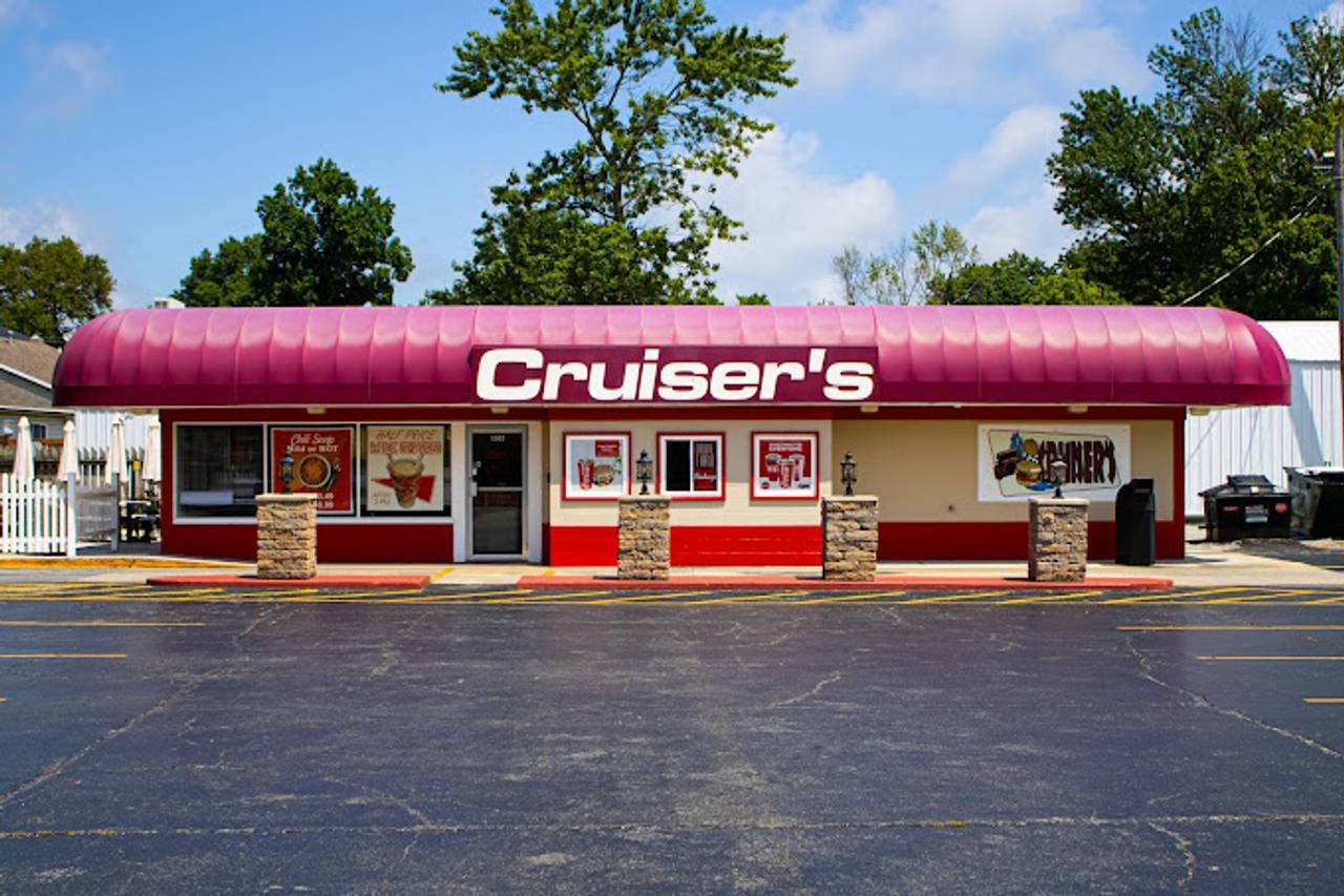 Wide daytime view of the Cruiser's Drive Thru building and parking lot