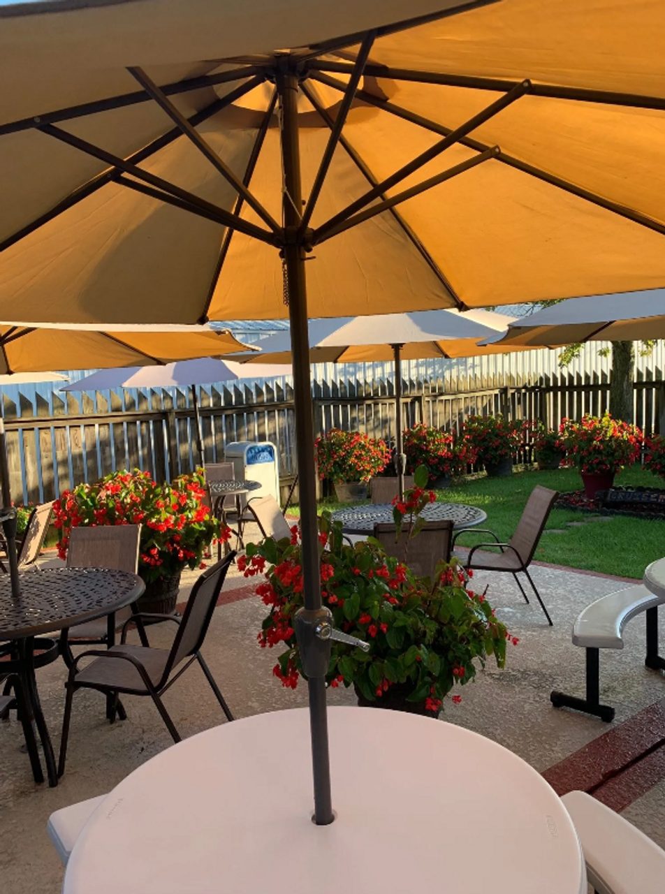 Cruiser's patio with flower planters and shaded seating